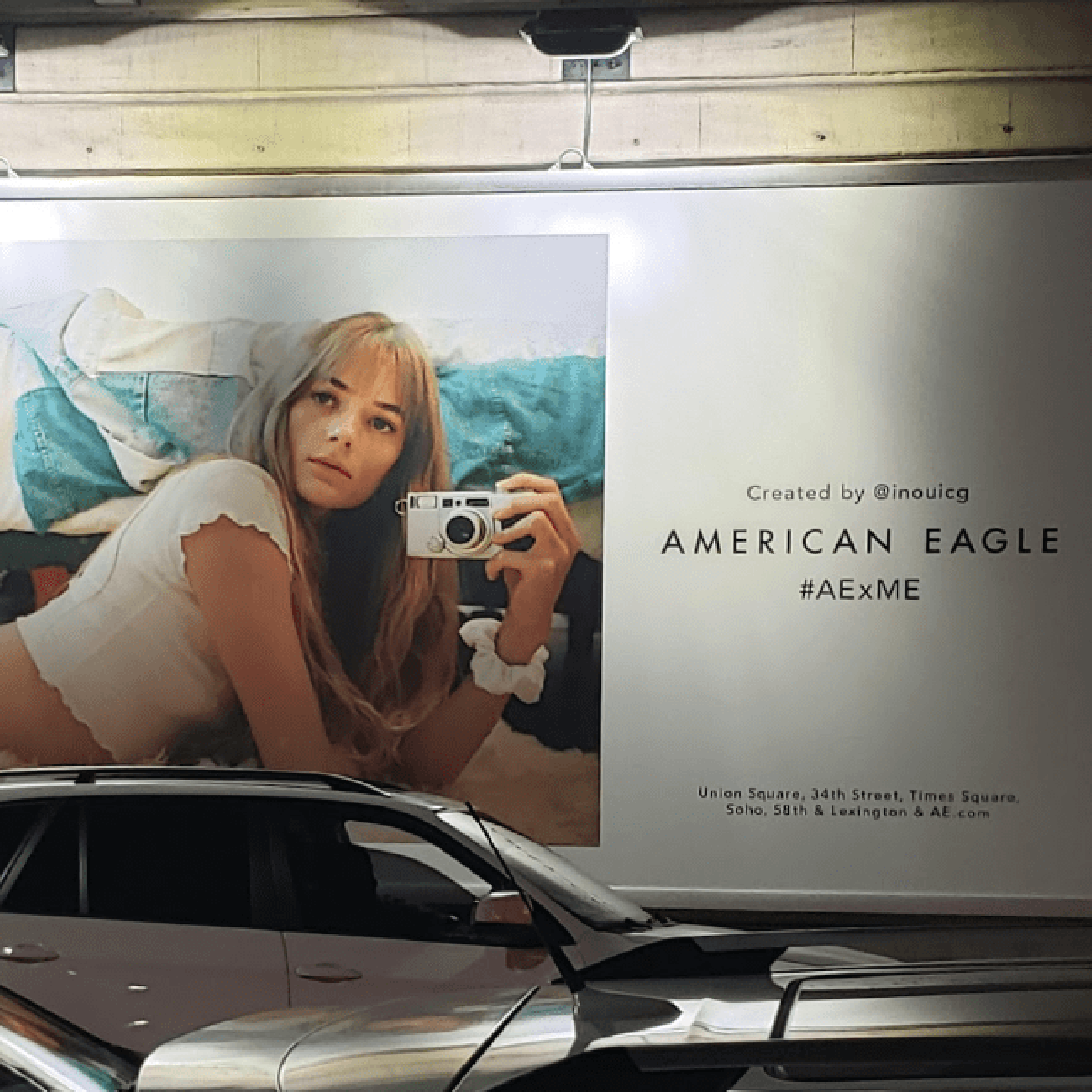 Billboard from American Eagle in the street promoting their hastag with a picture of a girl on the side.